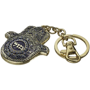 מחזיק מפתחות חמסה מתכת בצבע כחול עם כיתוב ״מזל״ | 5.5 ס״מ